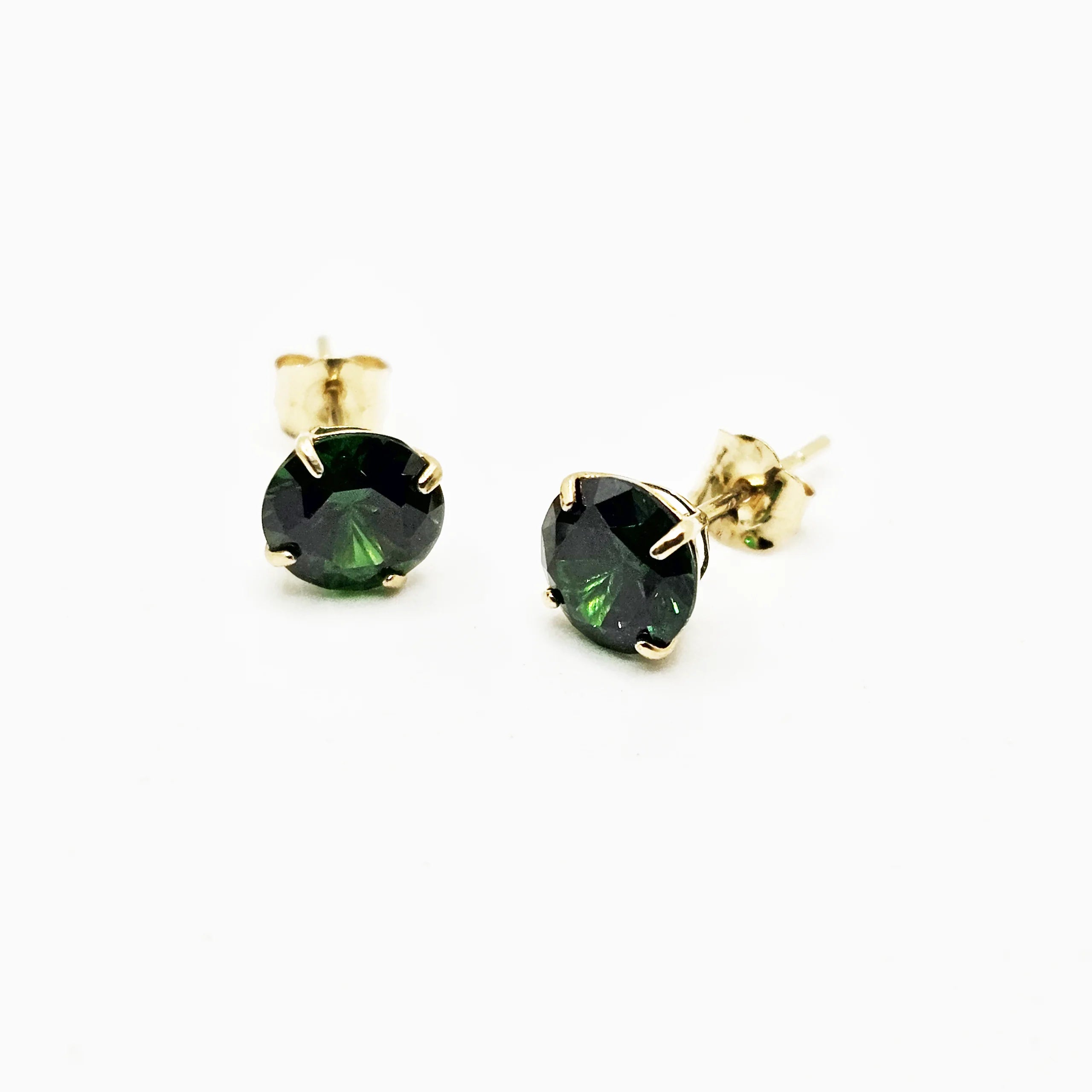 14k gold stud earrings featuring round lab-grown emeralds with secure butterfly backs.